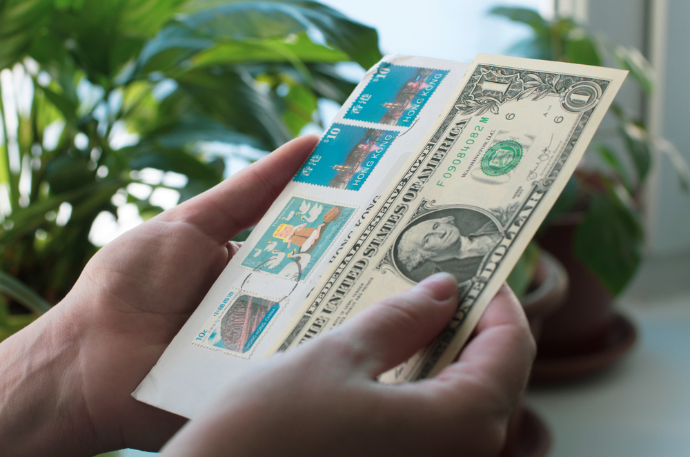 Is it possible to attach money to a letter instead of a stamp, and get it delivered?